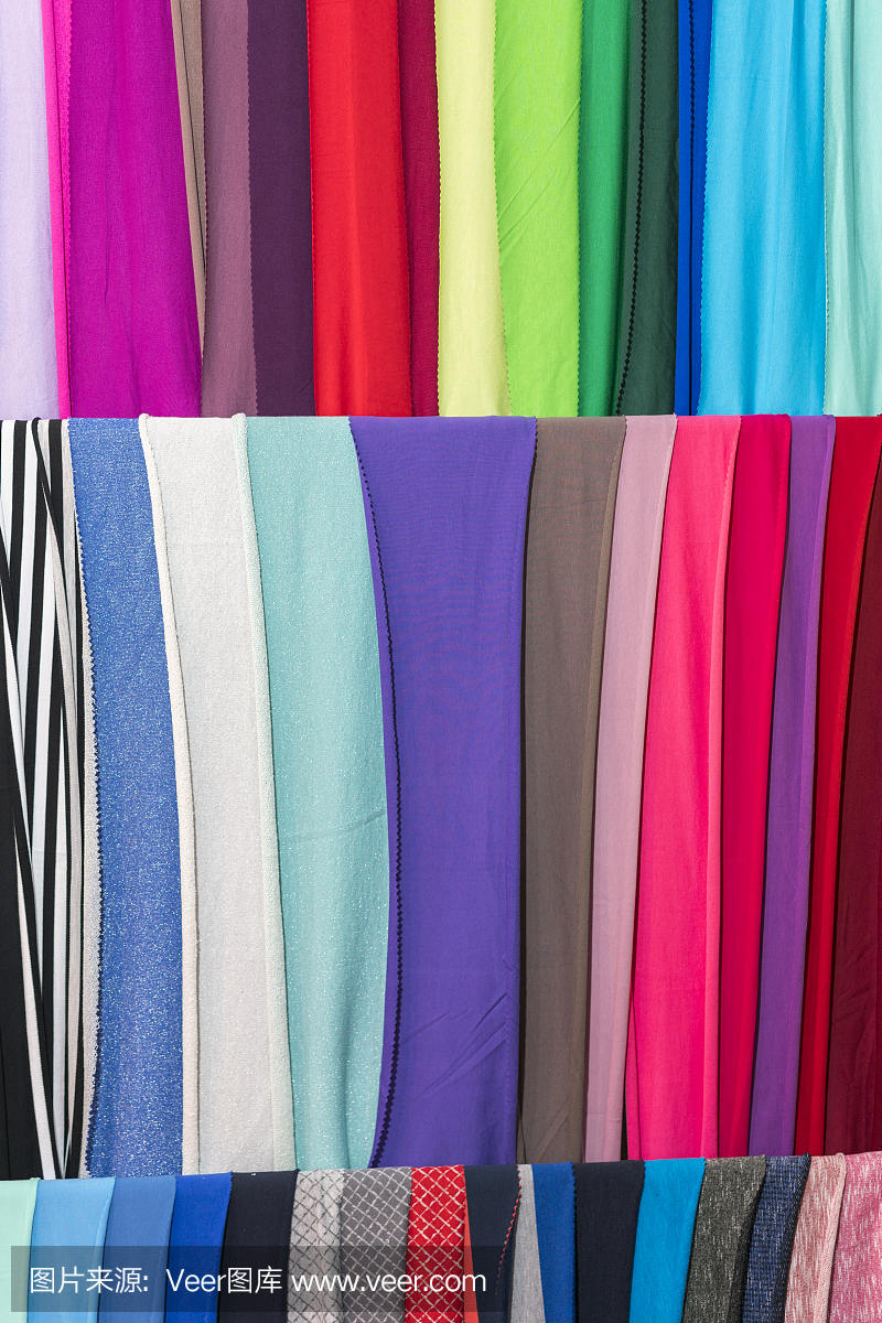 彩色布料背景紋理的圖片樣本。皺巴巴的織物。verticak照片